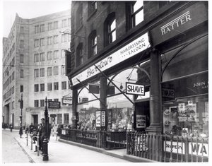 Barstows Barbershop on Wellington Street, Leeds, 1939 by English Photographer